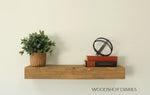 Load image into Gallery viewer, Wooden shelf with a plant, books, and a decorative object against a plain wall, featuring 'Woodshop Diaries' branding.
