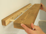 Load image into Gallery viewer, Wooden shelf being held by a hand with a plain background
